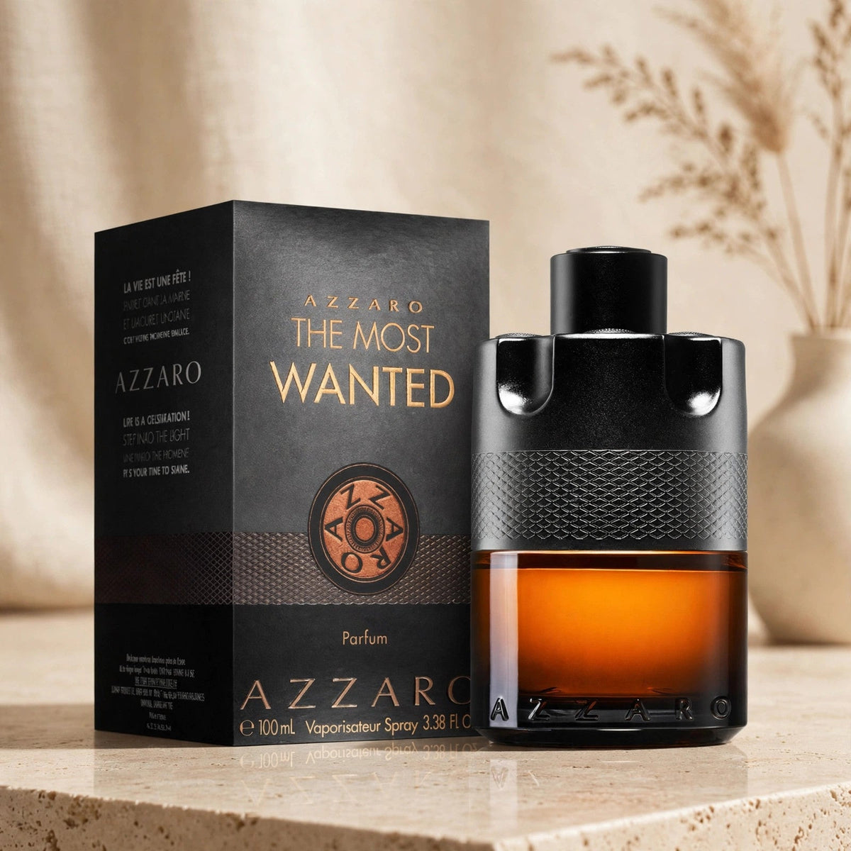 Azzaro The Most Wanted Parfum 100ml bottle and box in warm beige studio