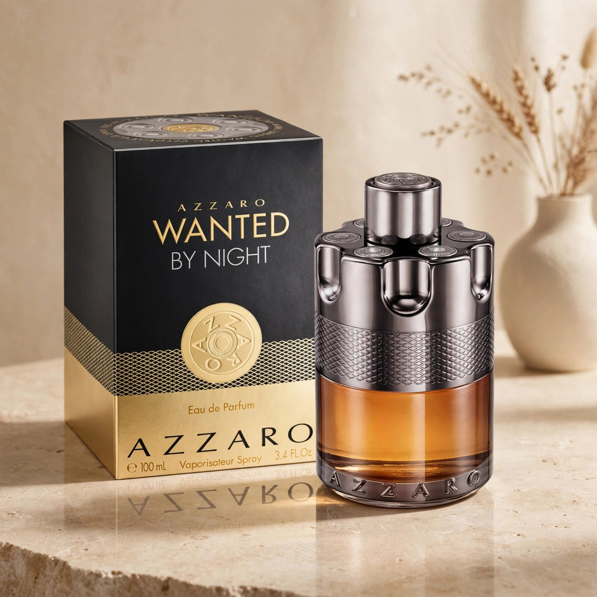 Azzaro Wanted By Night Eau de Parfum 100ml bottle and box in warm beige studio
